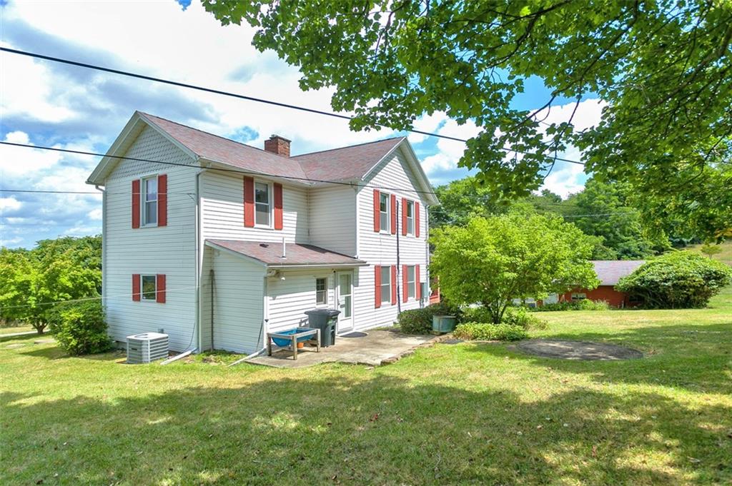114 Cemetery Road Perryopolis, PA 15473 - Photo 35 of 35 a front view of house with yard and green space