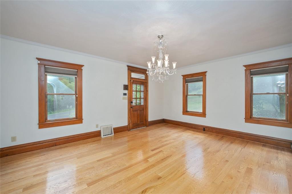 114 Cemetery Road Perryopolis, PA 15473 - Photo 5 of 35 a view of an empty room with chandelier and a window