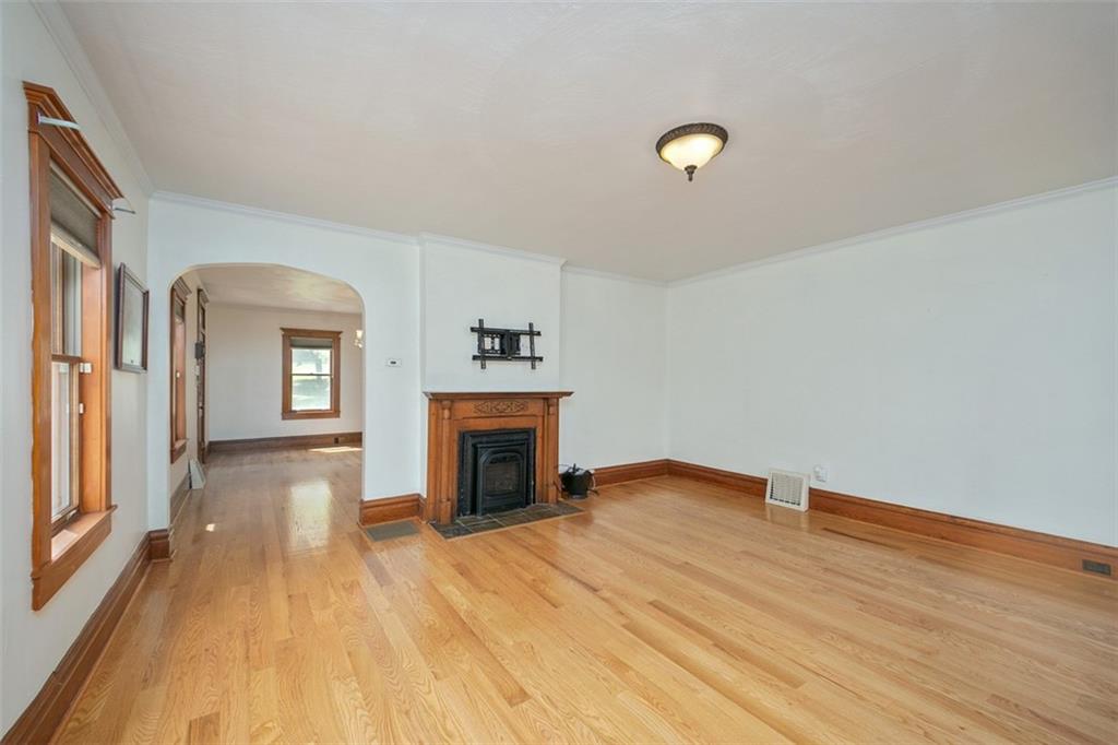 114 Cemetery Road Perryopolis, PA 15473 - Photo 6 of 35 a view of empty room with wooden floor and fan