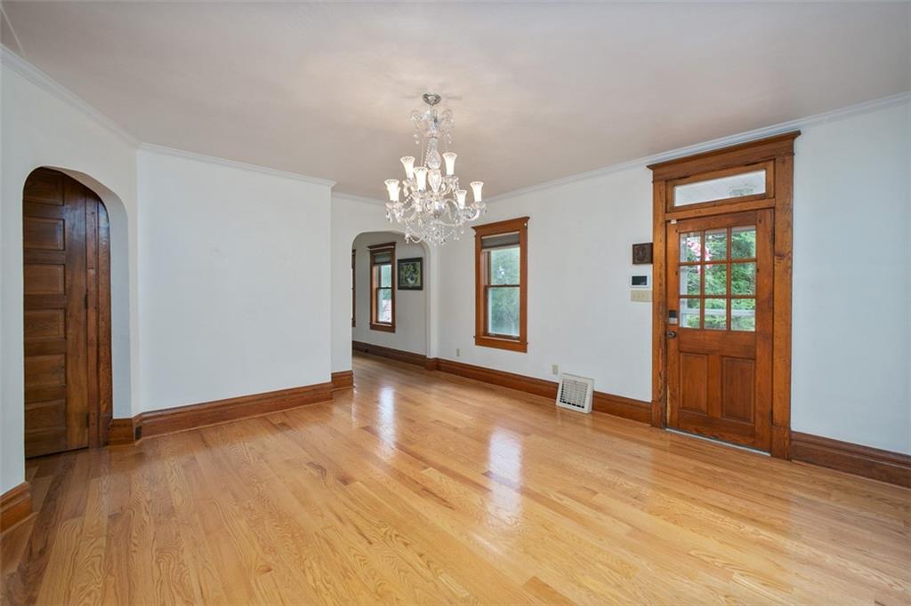 114 Cemetery Road Perryopolis, PA 15473 - Photo 8 of 35 a view of an empty room with chandelier and wooden floor