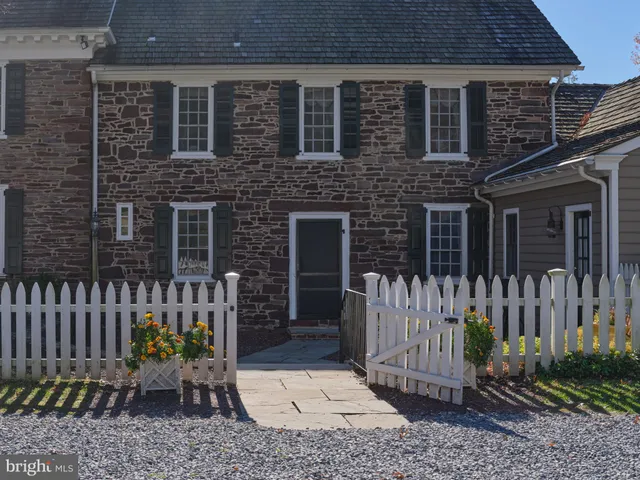 a view of a livingroom with workspace and a window