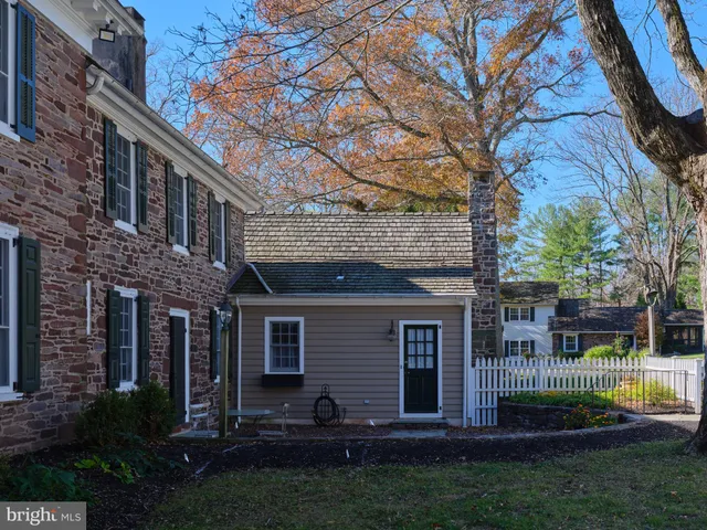 a dining room with furniture and a fireplace
