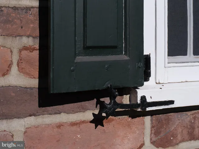 a bedroom with a bed and a fireplace
