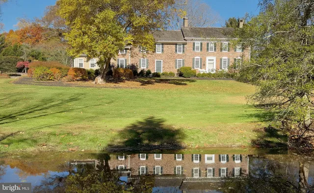a view of a bedroom with furniture and window