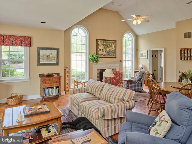 a kitchen with stainless steel appliances granite countertop a refrigerator a stove a sink dishwasher and a refrigerator with wooden cabinets