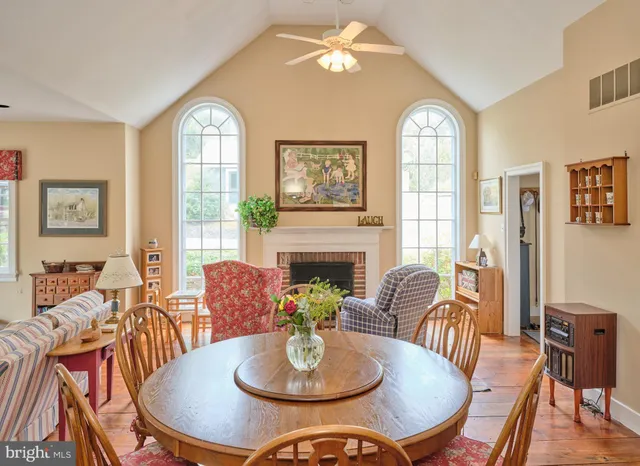 a view of a dining room with furniture window and wooden floor