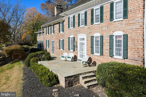 an aerial view of a house with a yard and fountain