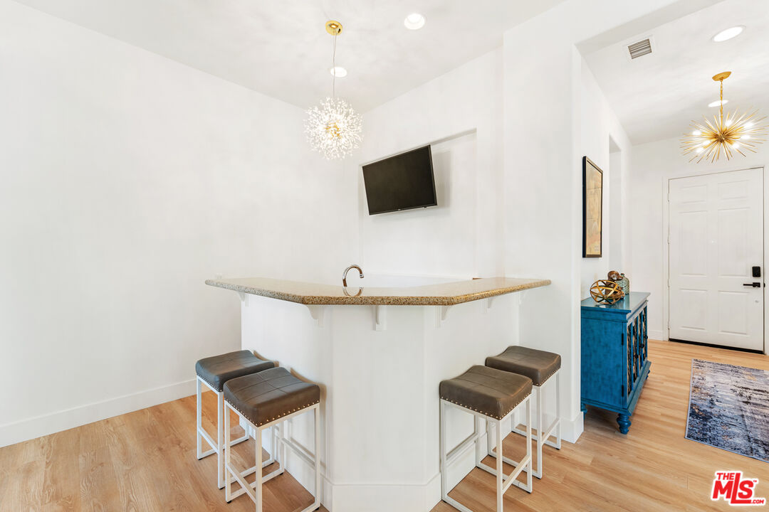 65 Shoreline Drive Rancho Mirage, CA 92270 - Photo 17 of 37 a living room with furniture and a flat screen tv