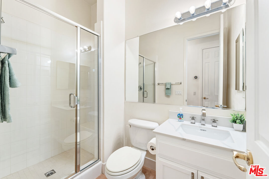 65 Shoreline Drive Rancho Mirage, CA 92270 - Photo 20 of 37 a bathroom with a sink a toilet and shower