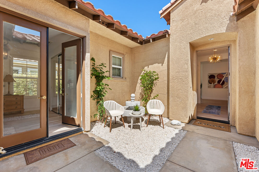 65 Shoreline Drive Rancho Mirage, CA 92270 - Photo 22 of 37 a view of a patio with dining table and chairs