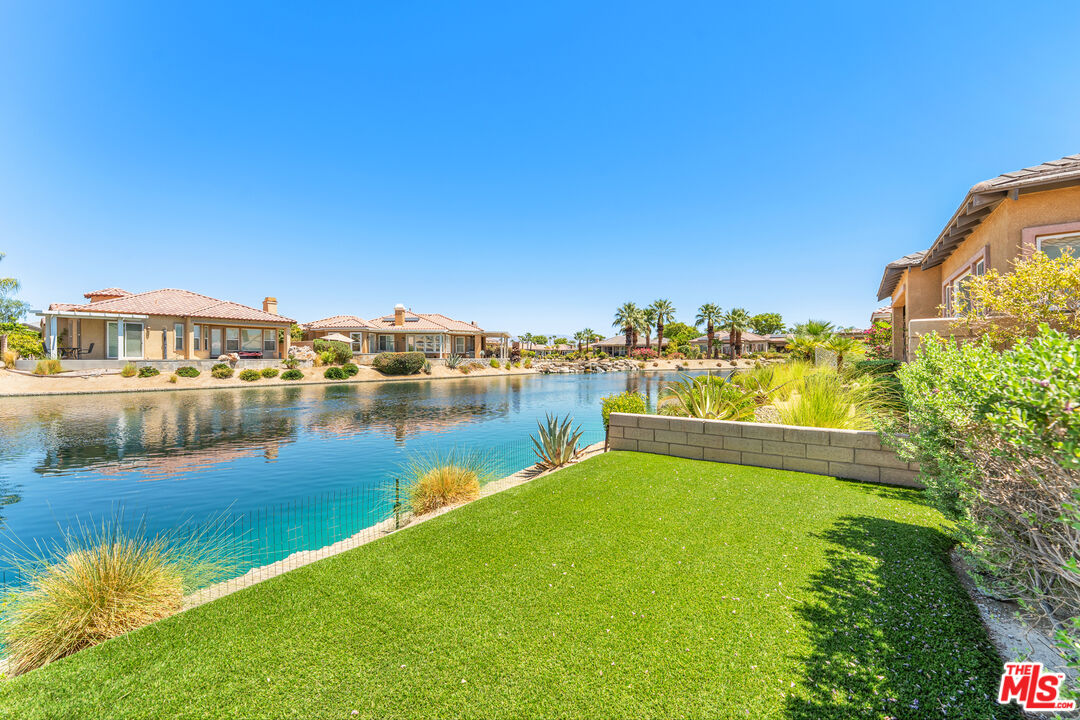 65 Shoreline Drive Rancho Mirage, CA 92270 - Photo 23 of 37 a view of a lake with houses