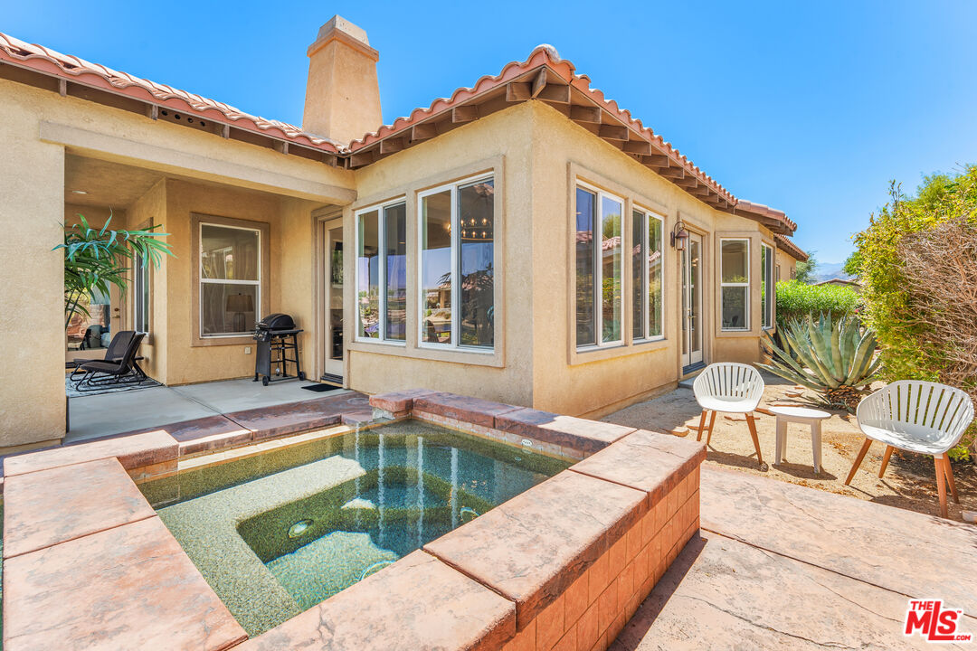 65 Shoreline Drive Rancho Mirage, CA 92270 - Photo 27 of 37 a view of a house with swimming pool and sitting area