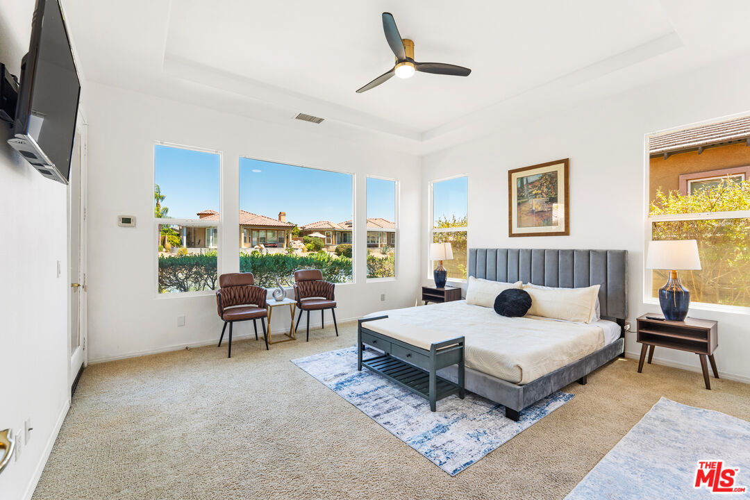 65 Shoreline Drive Rancho Mirage, CA 92270 - Photo 3 of 37 a bedroom with a bed and a flat screen tv