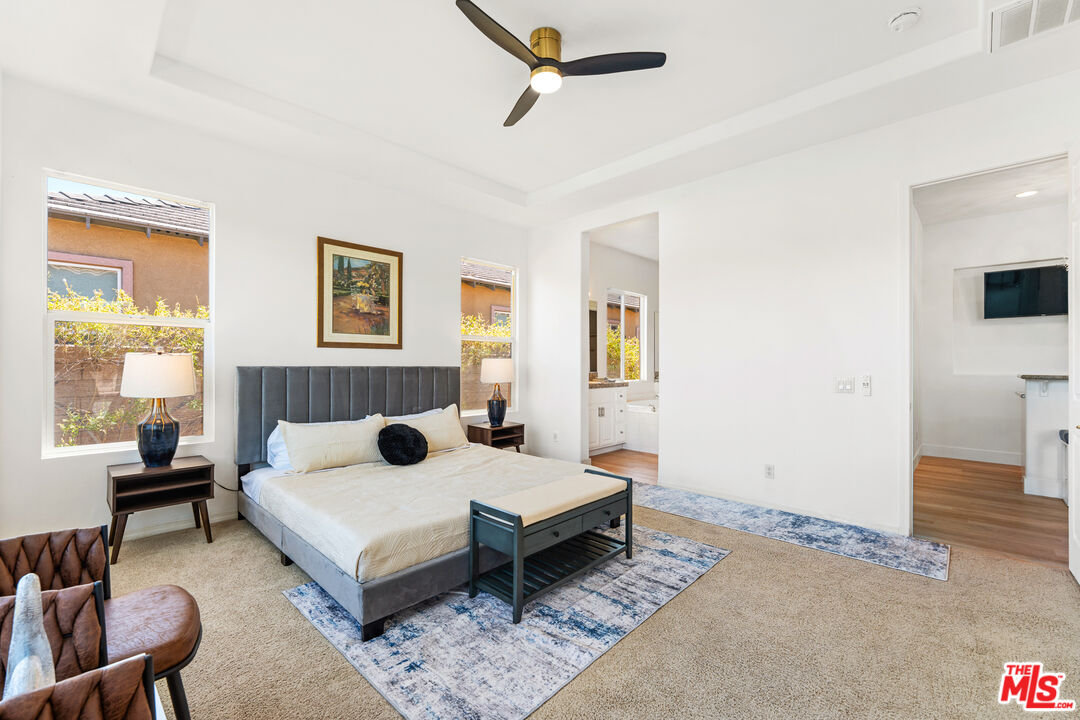 65 Shoreline Drive Rancho Mirage, CA 92270 - Photo 4 of 37 a bedroom with a bed and a couch