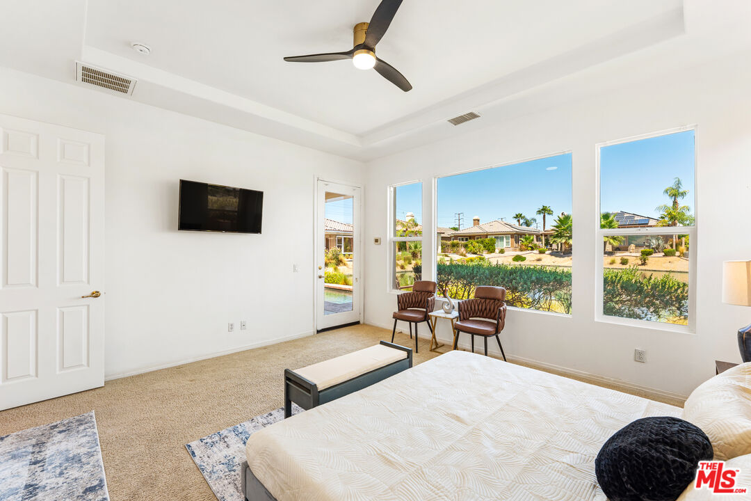 65 Shoreline Drive Rancho Mirage, CA 92270 - Photo 5 of 37 a bedroom with furniture and a window
