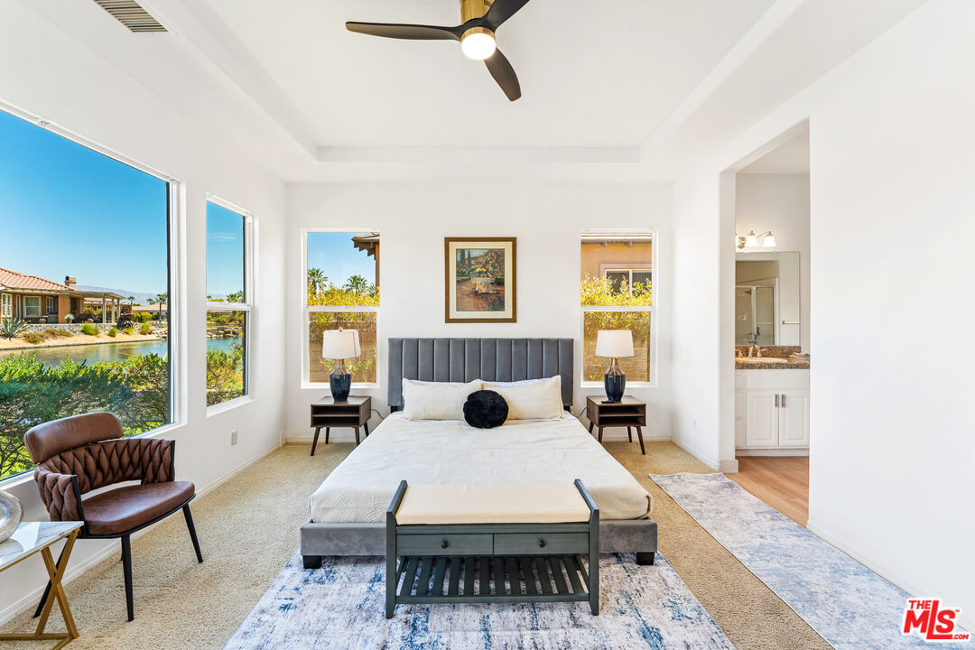 65 Shoreline Drive Rancho Mirage, CA 92270 - Photo 6 of 37 a living room with furniture rug and window