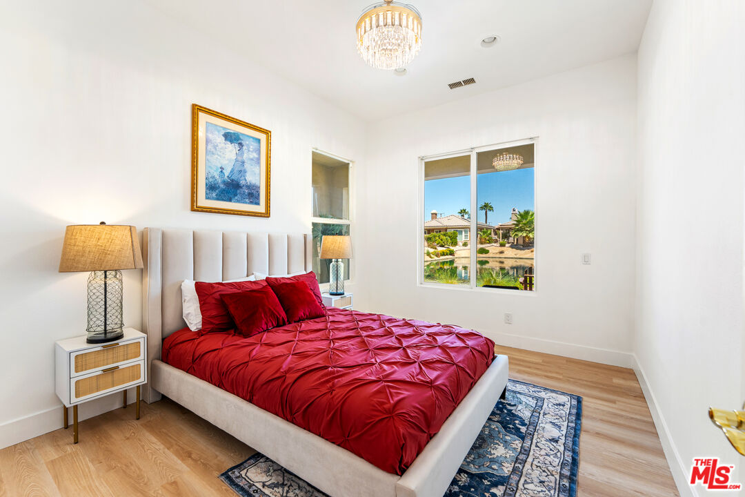 65 Shoreline Drive Rancho Mirage, CA 92270 - Photo 8 of 37 a bedroom with a bed and a window