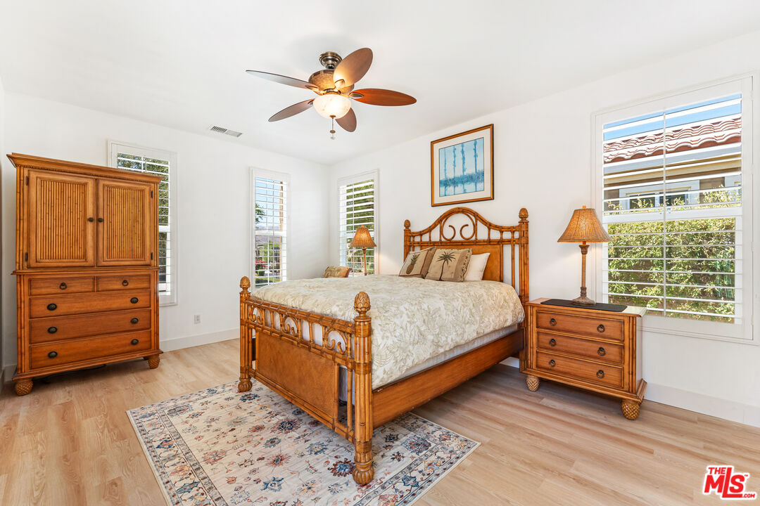 65 Shoreline Drive Rancho Mirage, CA 92270 - Photo 9 of 37 a bedroom with a bed and a dresser