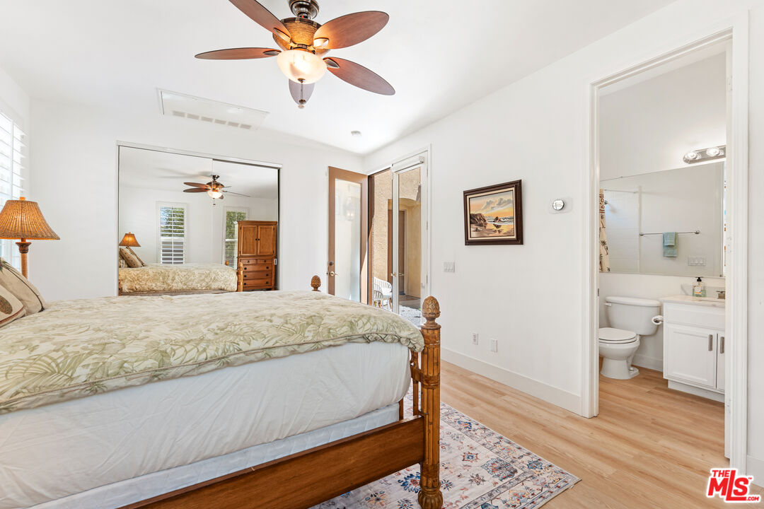 65 Shoreline Drive Rancho Mirage, CA 92270 - Photo 10 of 37 a bedroom with a bed and a view of bathroom