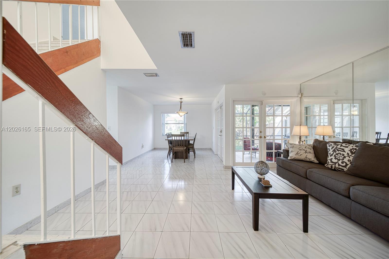 13337 Southwest 64th Lane Miami, FL 33183 - Photo 5 of 36 a living room with furniture and a wooden floor