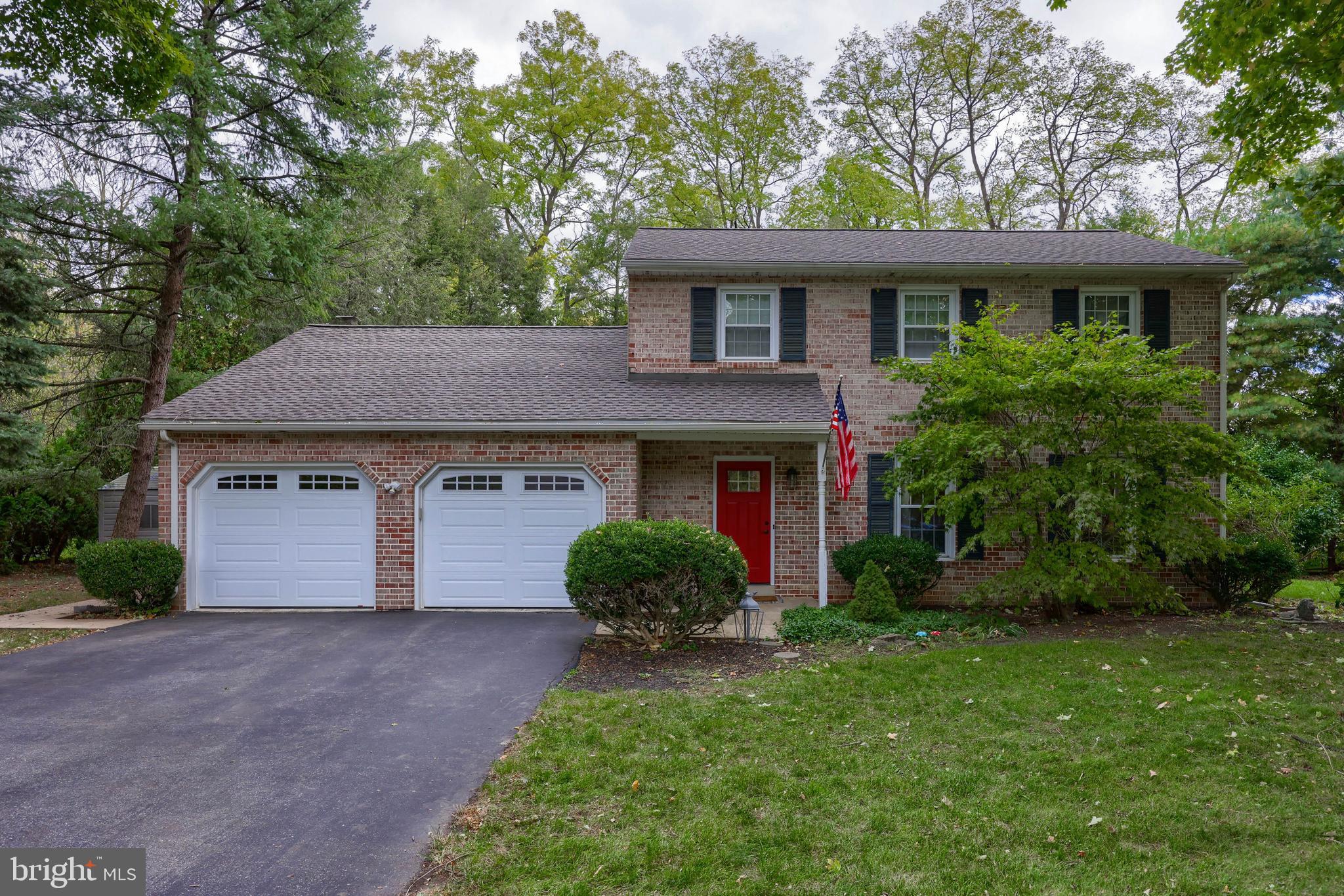 102 Suncrest Road Lancaster, PA 17601 - Photo 1 of 40 a front view of a house with a yard and garage