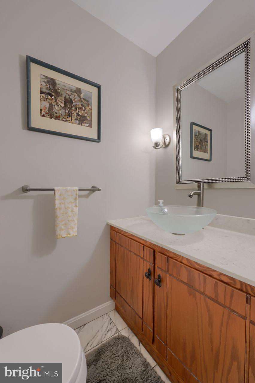 102 Suncrest Road Lancaster, PA 17601 - Photo 31 of 40 a bathroom with a toilet sink and mirror