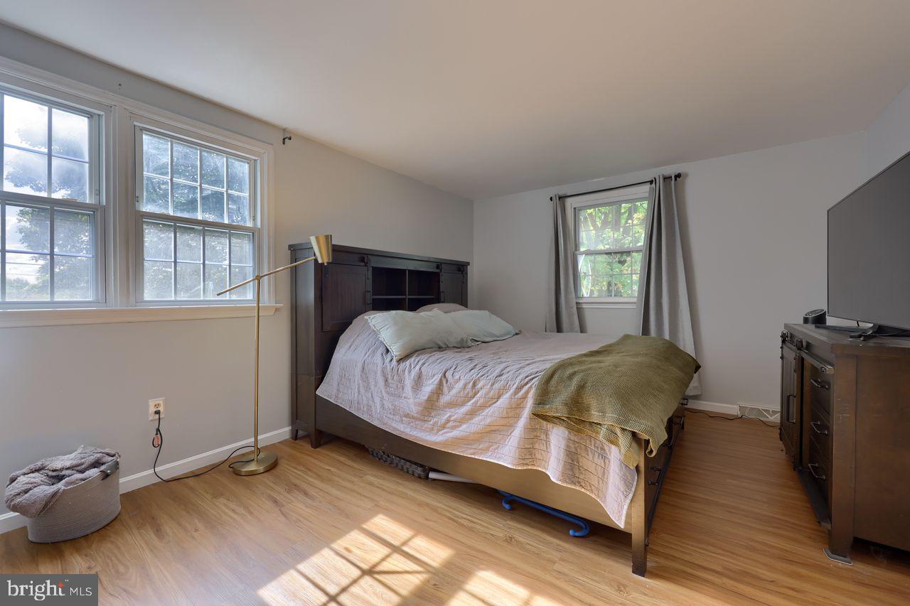 102 Suncrest Road Lancaster, PA 17601 - Photo 33 of 40 a spacious bedroom with a bed and wooden floor