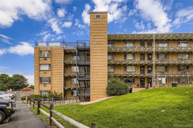 a view of a building with a yard