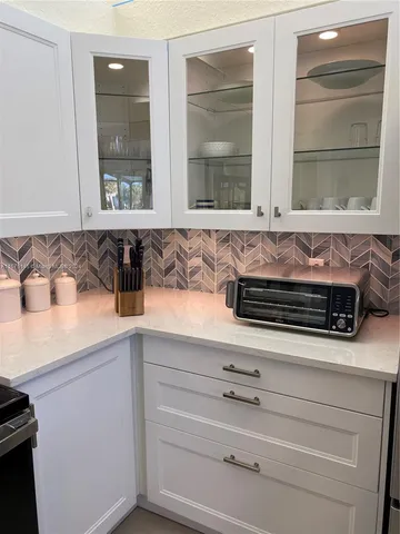 a view of a kitchen with appliances and cabinets