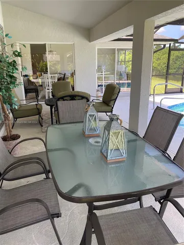 a view of swimming pool with a patio