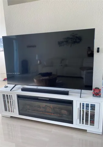 a stove top oven sitting inside of a kitchen