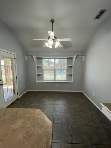 a kitchen with granite countertop stainless steel appliances and counter space