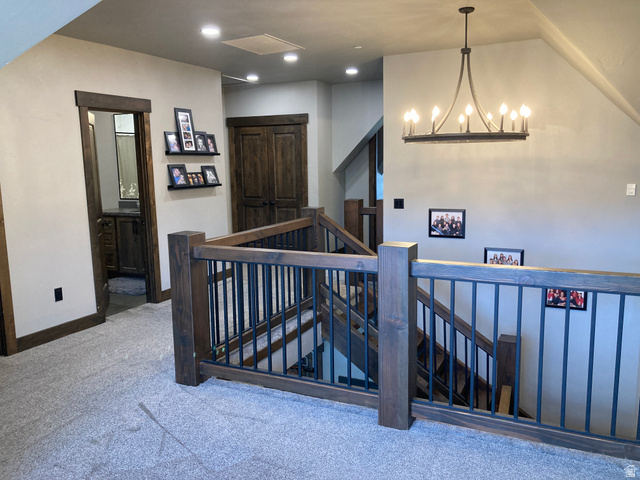 259 Meadow Drive Springville, UT 84663 - Photo 30 of 62 Staircase featuring carpet flooring and a chandelier