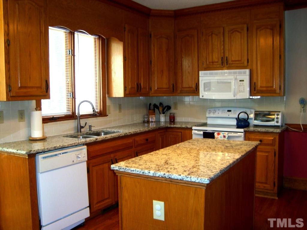 1412 Shadowview Court Raleigh, NC 27614 - Photo 7 of 25 Kitchen has granite countertops and large center island. Kitchen