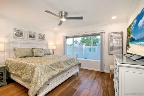 a bedroom with a bed and a night stand