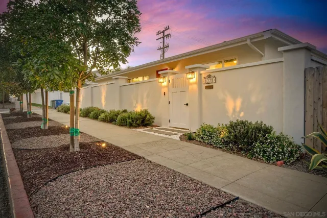 an aerial view of a building with outdoor space and trees all around