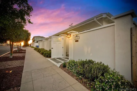 a car parked in front of white house