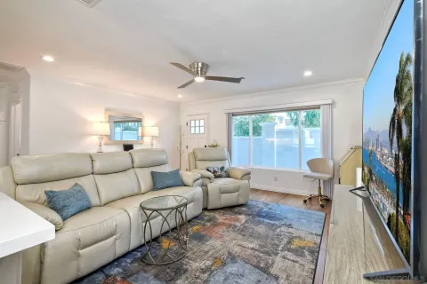 a kitchen with a table chairs sink and cabinets