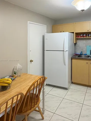 a reading room with furniture and a window