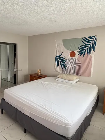 a living room with furniture and flat screen tv