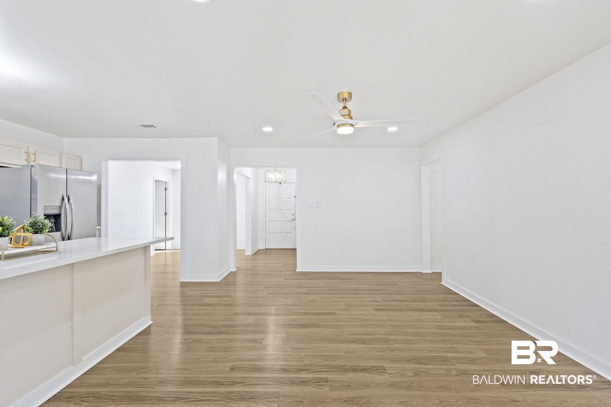5398 Quail Run North Theodore, AL 36582 - Photo 25 of 46 Unfurnished living room with ceiling fan and light hardwood / wood-style floors