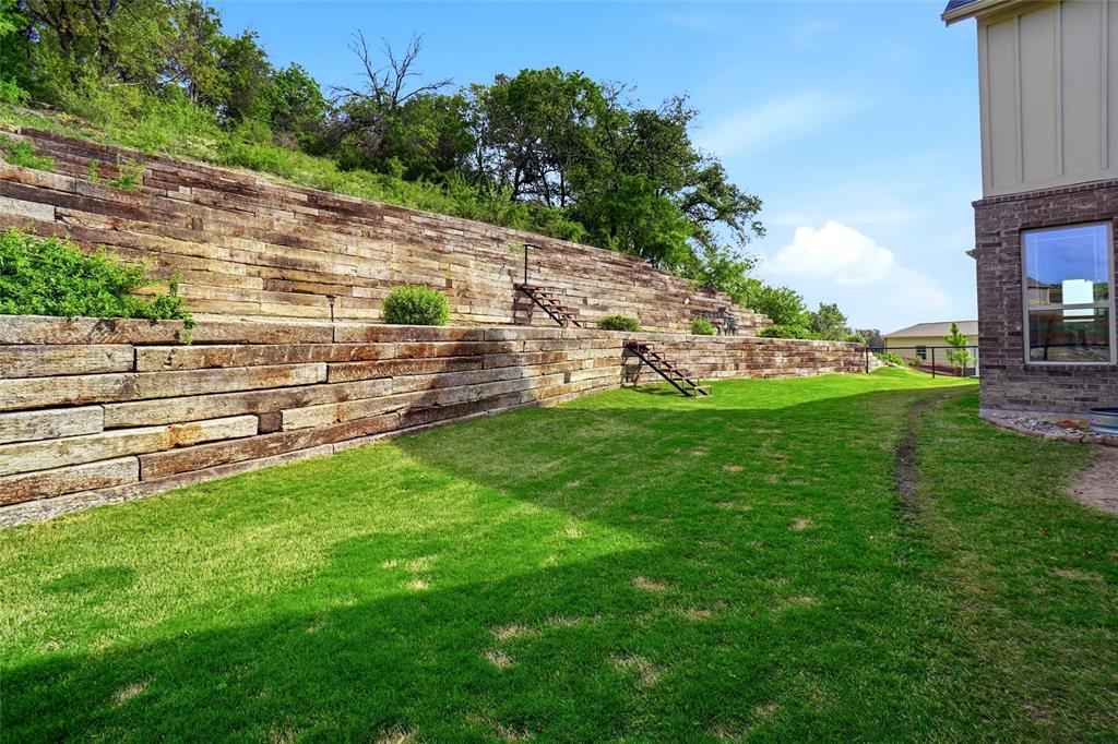 1024 Tex Lane Springtown, TX 76082 - Photo 10 of 40 a view of a backyard with a garden