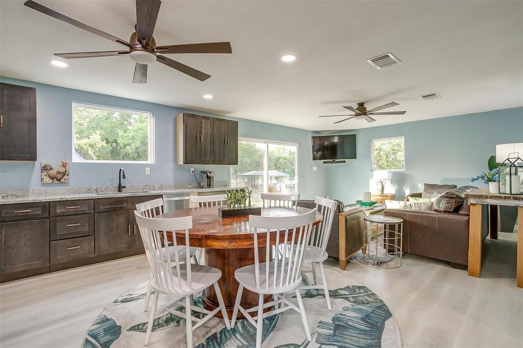 520 Deer Trail Gordon, TX 76453 - Photo 23 of 40 Kitchen featuring ceiling fan, dark wood finish cabinetry, light wood-style floors, light stone countertops, and recessed lighting