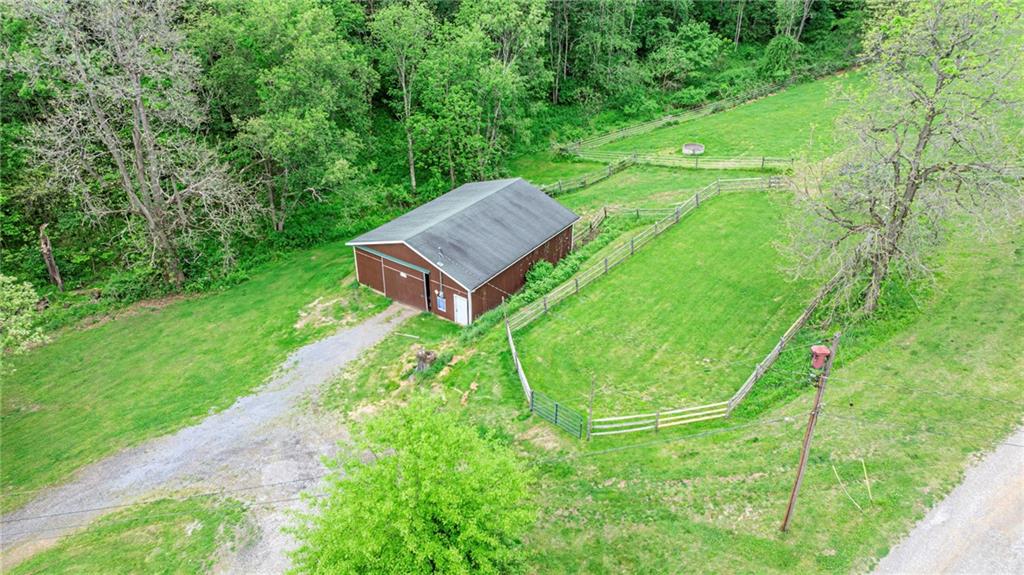 383 Ridgemont Drive Midland, PA 15059 - Photo 11 of 44 a view of a backyard with a garden