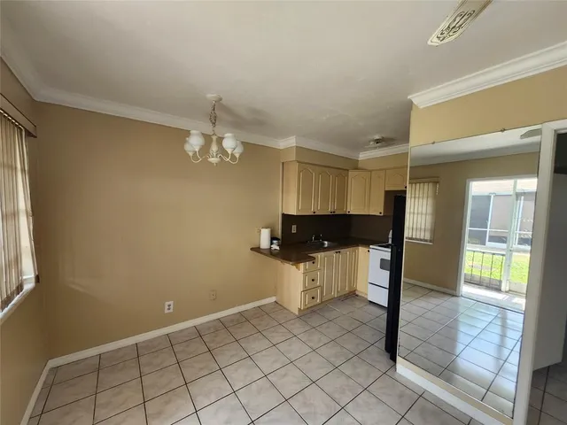 a kitchen with a sink cabinets and appliances