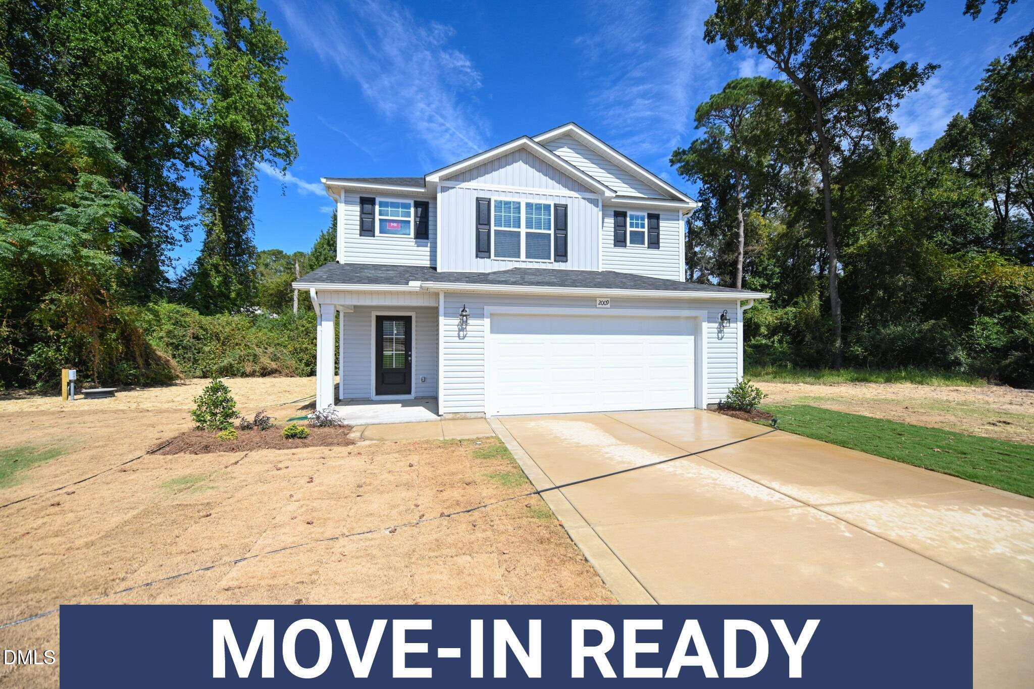 2009 Black Bear Court, Unit (LOT 5) Hope Mills, NC 28348 - Photo 1 of 29 a black and white house with a outdoor space