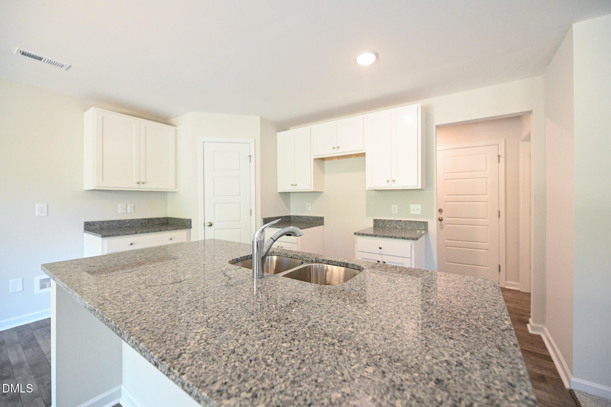 2009 Black Bear Court, Unit (LOT 5) Hope Mills, NC 28348 - Photo 11 of 29 a kitchen with granite countertop a sink and a stove top oven