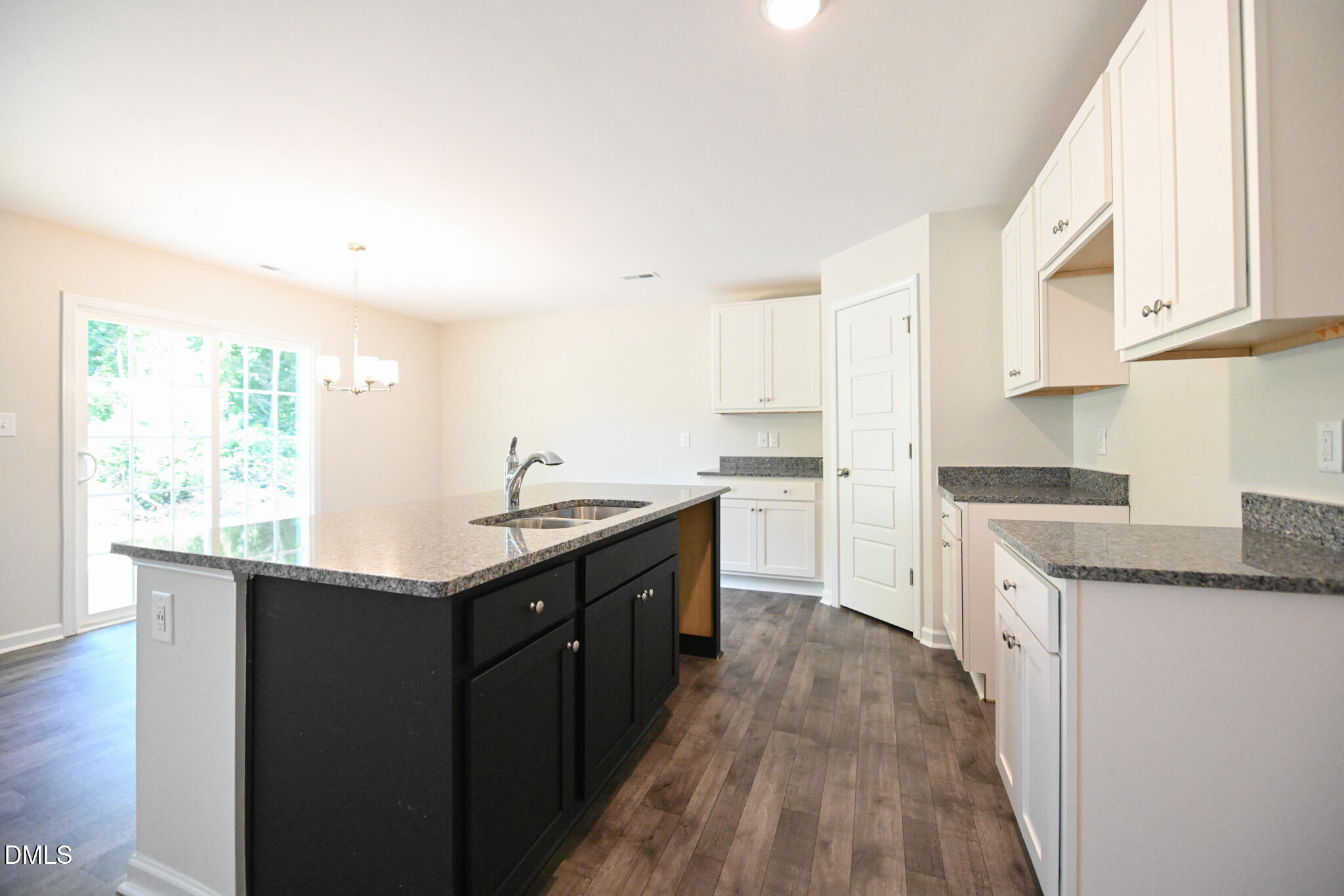 2009 Black Bear Court, Unit (LOT 5) Hope Mills, NC 28348 - Photo 14 of 29 a kitchen with granite countertop a sink a counter top space and cabinets