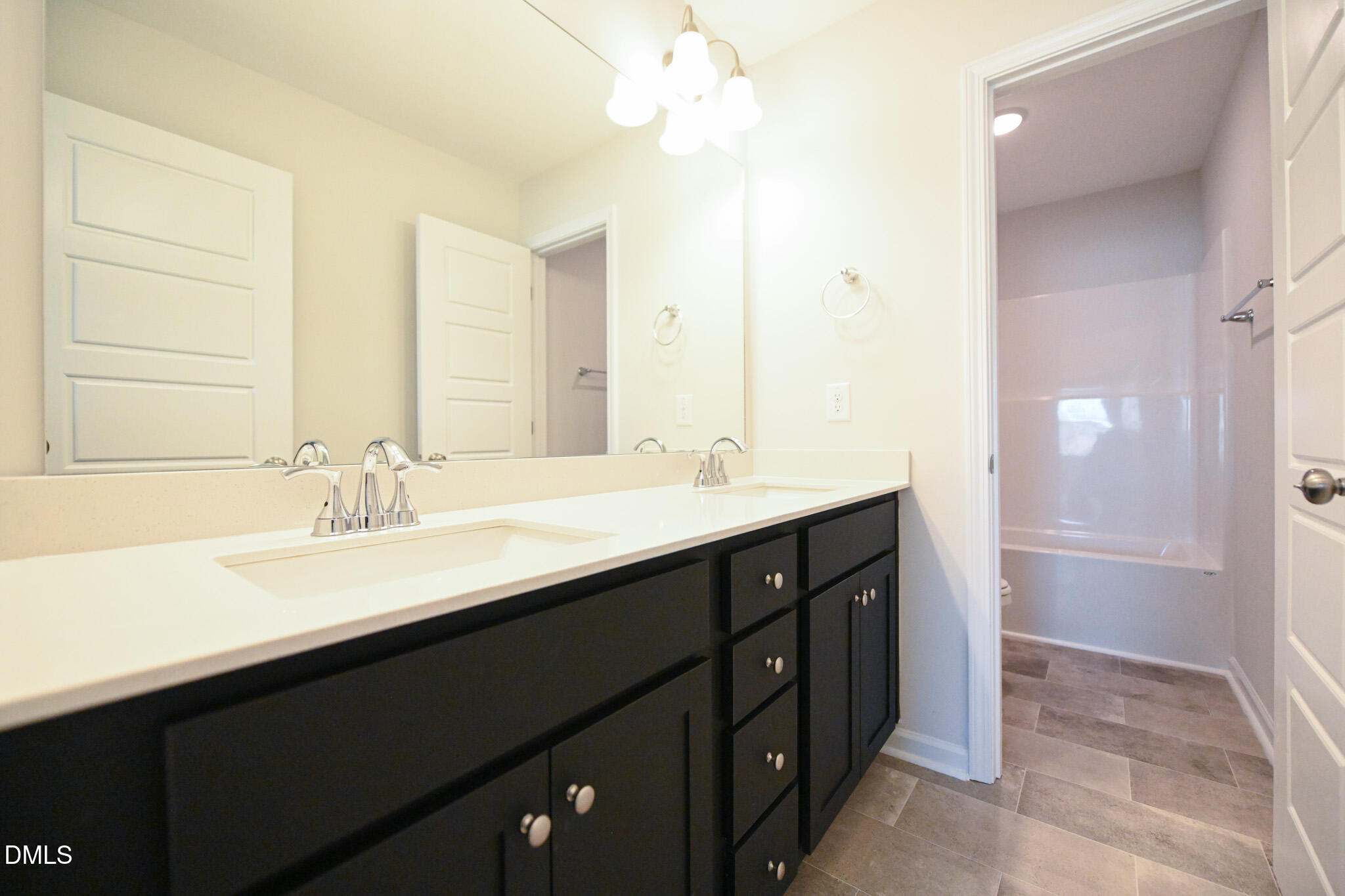 2009 Black Bear Court, Unit (LOT 5) Hope Mills, NC 28348 - Photo 25 of 29 a bathroom with a double vanity sink a mirror and a shower