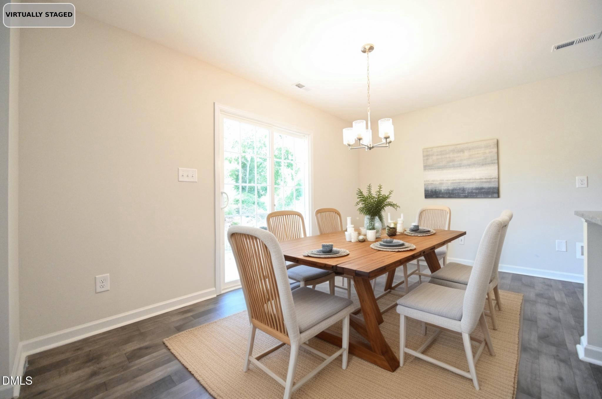 2009 Black Bear Court, Unit (LOT 5) Hope Mills, NC 28348 - Photo 9 of 29 a view of a dining room with furniture window and wooden floor